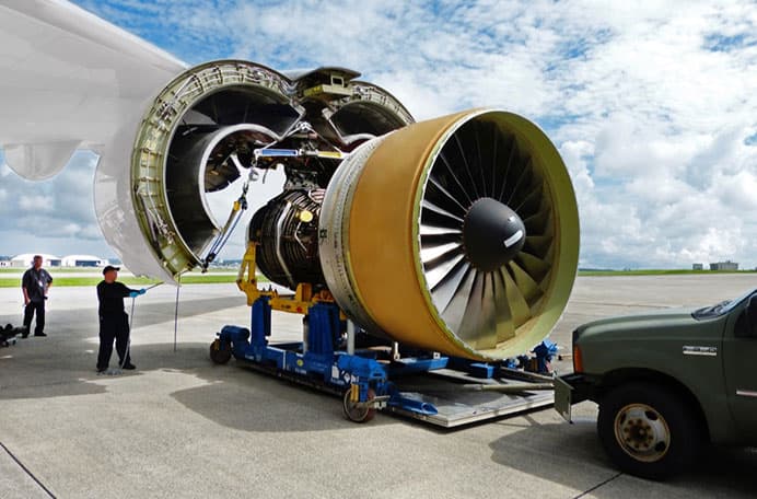 Service team working on an aircraft engine