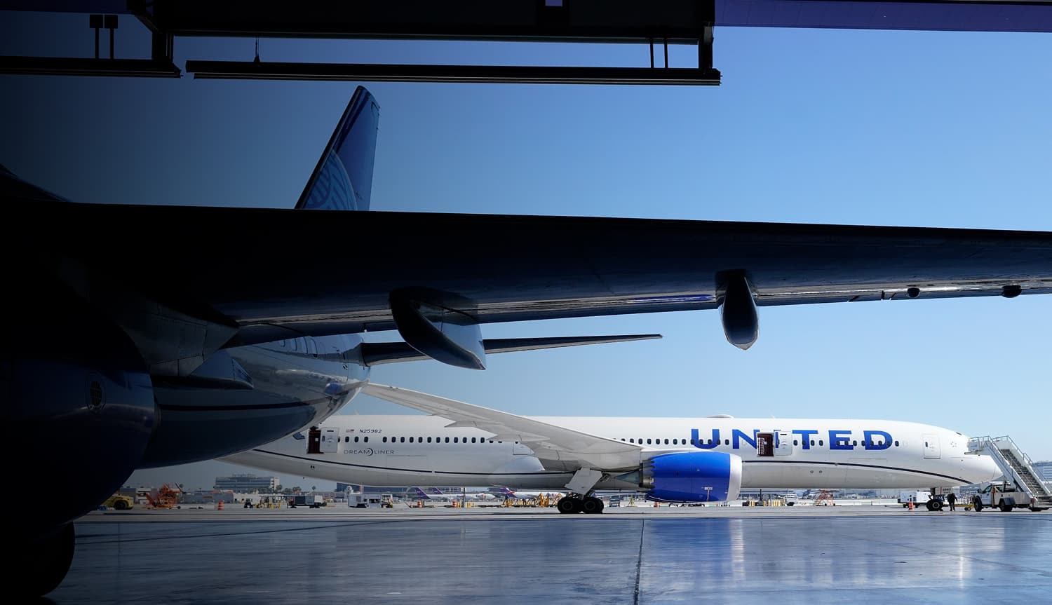 Aircraft maintenance work being performed in a United Airlines hangar
