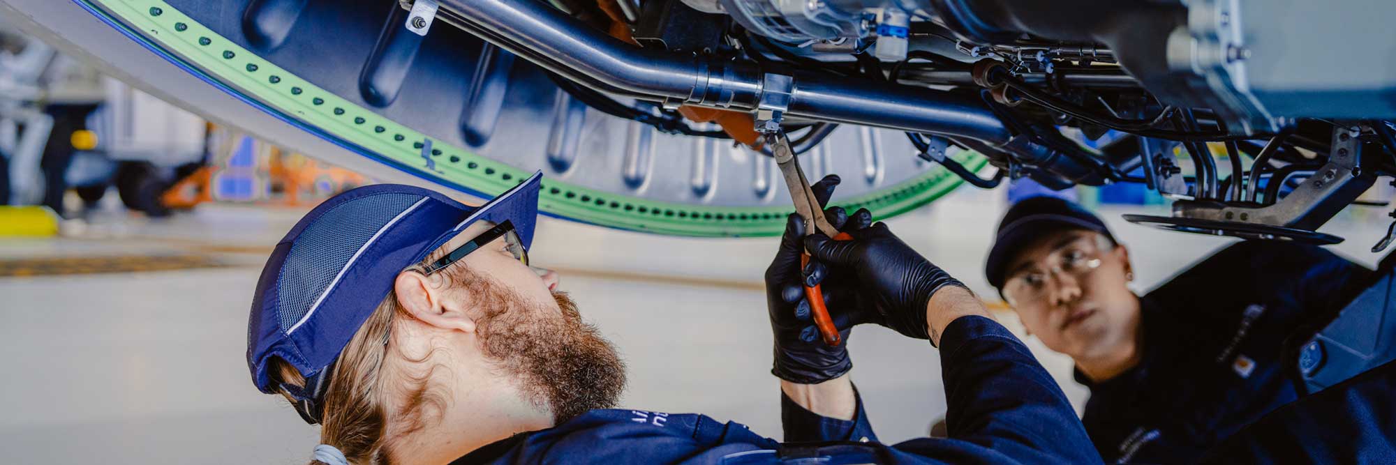 Service team working on an aircraft